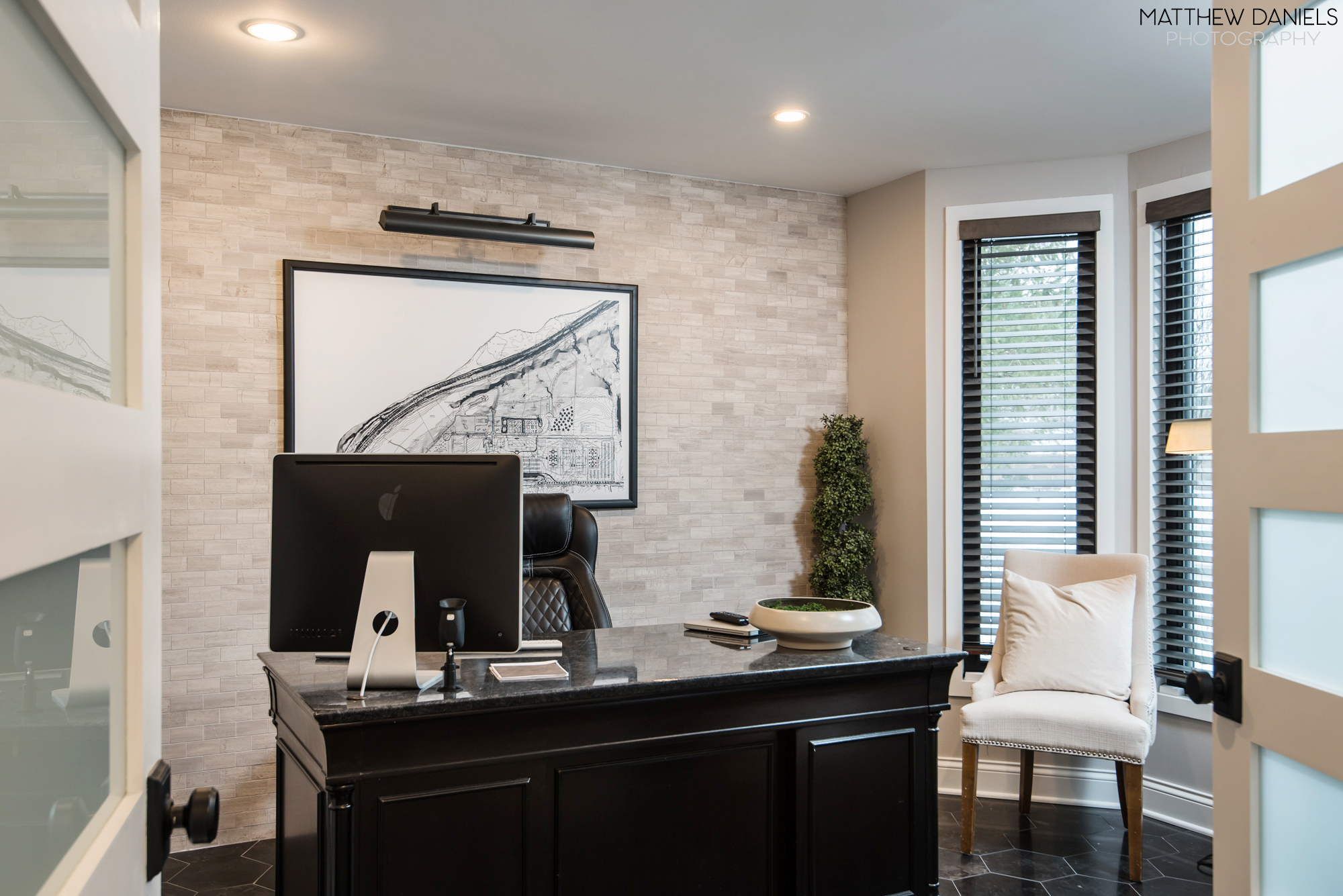 Home office with stone wall
